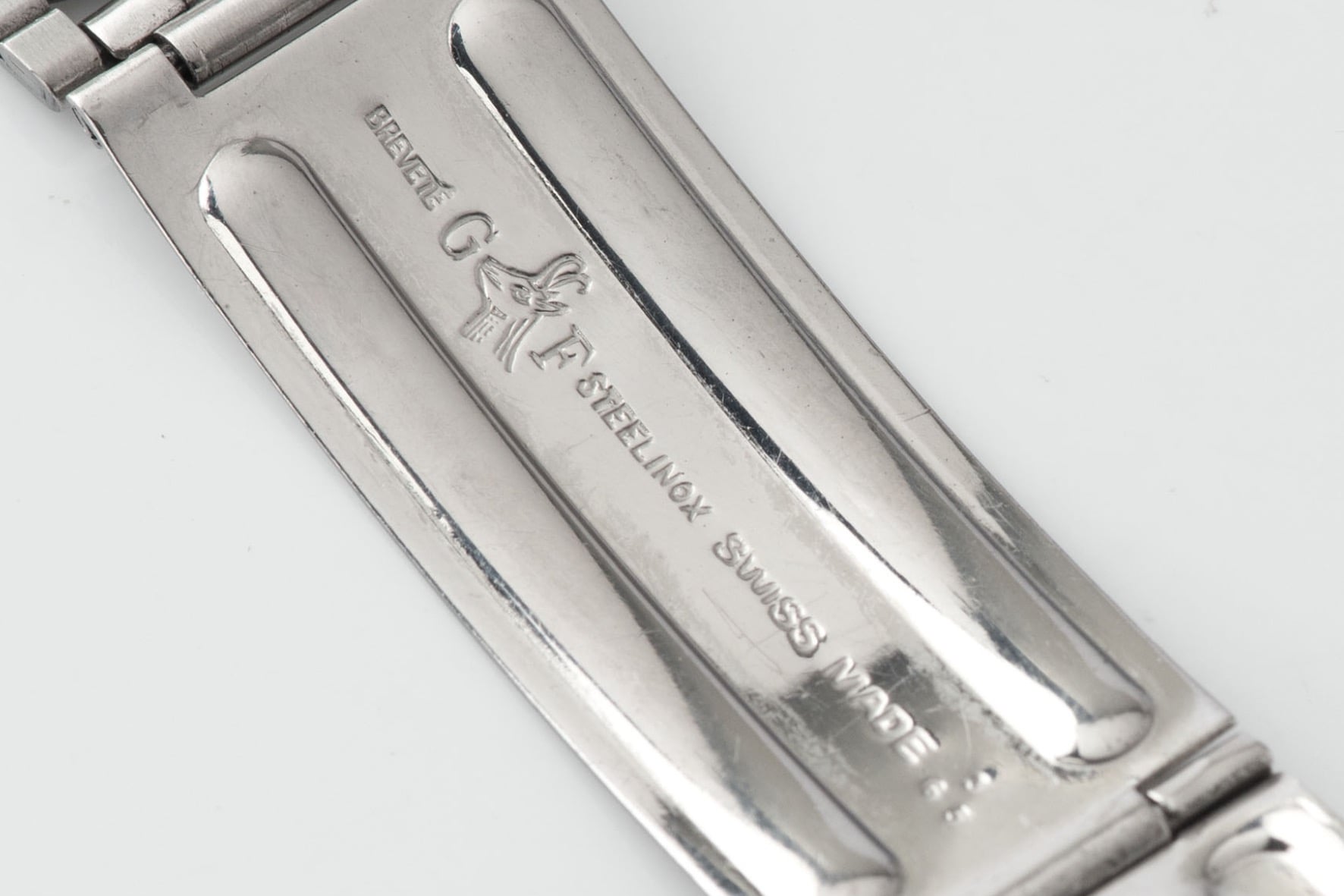 Gay Frères clasp stamp on a vintage bracelet, showing the GF ram mark