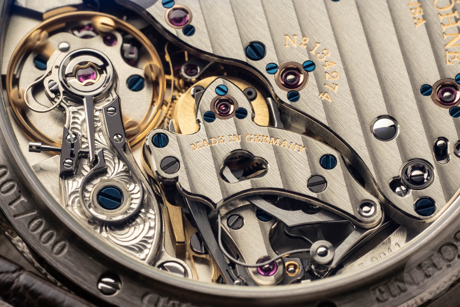 Macro of an A. Lange & Söhne Richard Lange movement with untreated German silver bridges, Glashütte ribbing, blued screws, and gold chatons